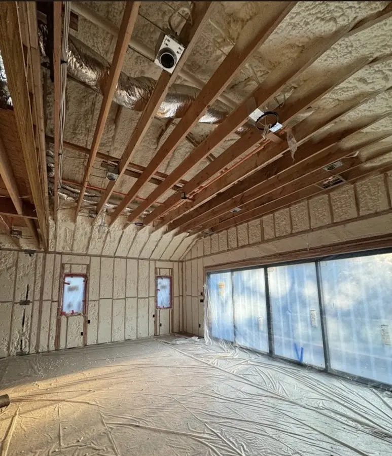 Interior walls and ceiling insulated with spray foam during new construction in Narragansett